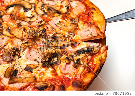 Fresh pizza with bacon, mushrooms and cheese on a light background. Close-up, selective focus 78671955