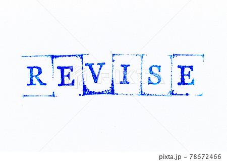 Blue color ink rubber stamp in word revise on white paper background 78672466