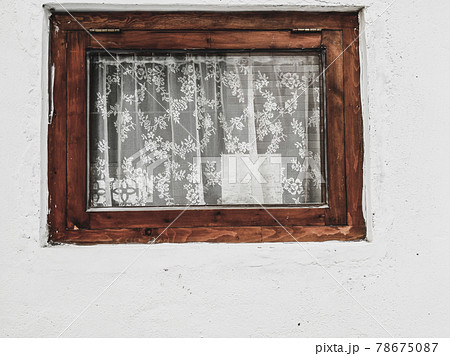 Rustic Window with white lace curtains. Old Vintage window Grunge cement Wall 78675087