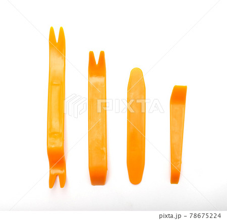 Set of tools for dismantling the interior trim of the passenger compartment on a white background, isolate. Close-up Set of tools for dismantling the interior trim of the passenger compartment on a white background, isolate. Close-up 78675224