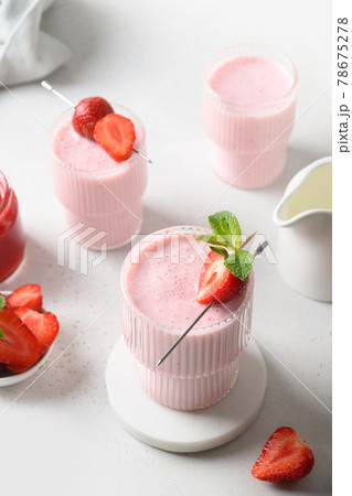 Indian strawberry lassi or milkshake on white background Indian strawberry lassi or milkshake on white background 78675278