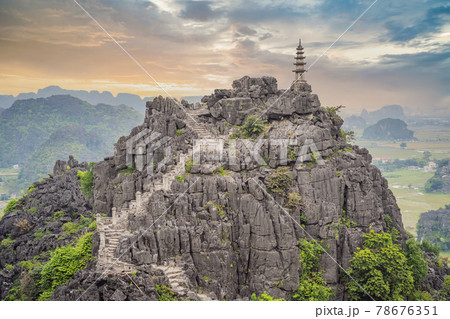 Top pagoda of Hang Mua temple, rice fields, Ninh Binh, Vietnam. Vietnam reopens borders after quarantine Coronovirus COVID 19 Top pagoda of Hang Mua temple, rice fields, Ninh Binh, Vietnam. Vietnam reopens borders after quarantine Coronovirus COVID 19 78676351