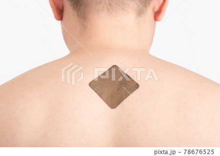 The guy with the anti-tobacco medical plaster on the skin of the body to get rid of the bad habit of smoking, a dose of nicotine, healthy The guy with the anti-tobacco medical plaster on the skin of the body to get rid of the bad habit of smoking, a dose of nicotine, healthy 78676525