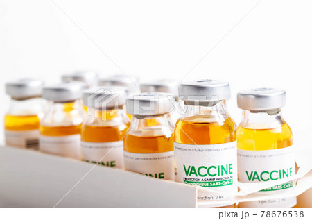 Vials of coronavirus medicine are in packaging on a white background. Vaccine test concept in a laboratory, macro 78676538