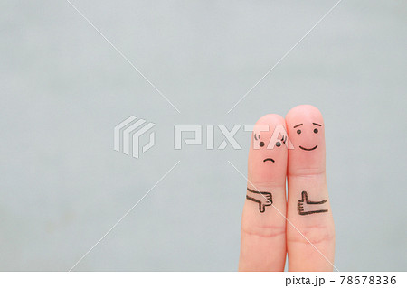 Fingers art of couple. Woman showing thumb down and man showing thumb up. Fingers art of couple. Woman showing thumb down and man showing thumb up. 78678336