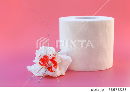 Toilet paper and blood. Concept of hemorrhoid treatment. 78678383