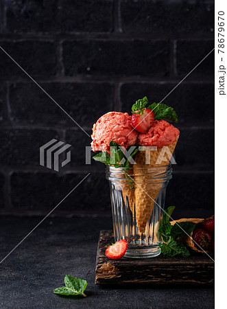 Strawberry ice cream in waffle cone 78679670