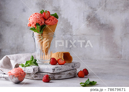 Strawberry ice cream in waffle cone 78679671