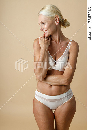 Beautiful mature woman in underwear with fit - Stock Photo [78679834] -  PIXTA