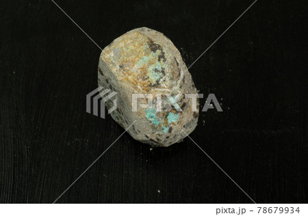 Lepidolite from Madagascar. Natural mineral stone on black background. Mineralogy, geology, magic of stones, semi-precious stones and samples of minerals. Close-up macro photo. 78679934