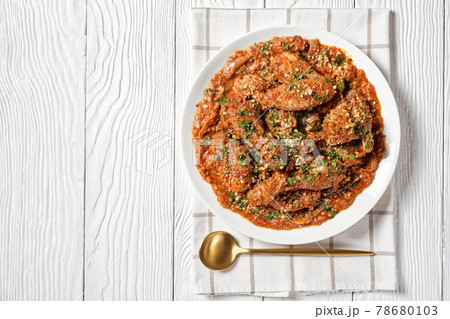 Chakhokhbili, stewed chicken in spicy tomato sauce Chakhokhbili, stewed chicken in spicy tomato sauce 78680103