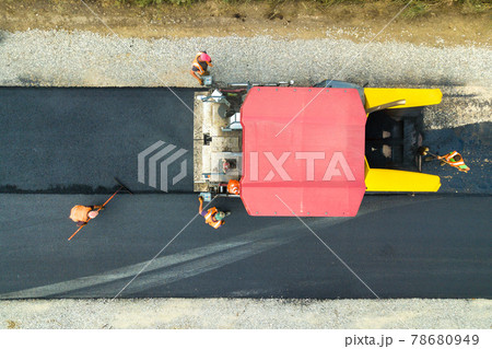 Aerial view of new road construction with asphalt laying machinery at work. 78680949
