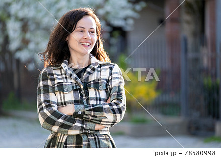 Portrait of happy pretty young woman outdoors on spring sunny day. 78680998