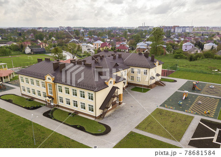 Aerial view of new preschool building in residential rural area. Aerial view of new preschool building in residential rural area. 78681584