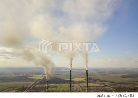 Tall pipes of power plant, white smoke on rural landscape and blue sky copy space background. Tall pipes of power plant, white smoke on rural landscape and blue sky copy space background. 78681783