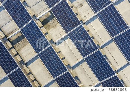 Top view of blue shiny solar photo voltaic panels system producing renewable clean energy abstract background. 78682068