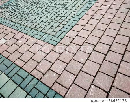 Stone pavement in perspective. Granite cobblestone pavement tiles. 78682178