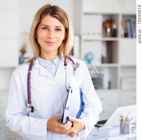 adult doctor female working in uniform in room 78690658