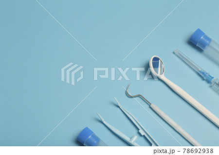 Medical instruments, devices and items on the colored table in the hospital. Syringe, test tube, tweezers. Healthcare, medicine, treatment and doctors concept 78692938