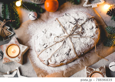 Traditional german stollen cake with Christmas decorations. Traditional german stollen cake with Christmas decorations. 78696839