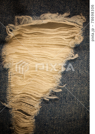 Torn denim vintage background. Torn denim vintage background. 78698306