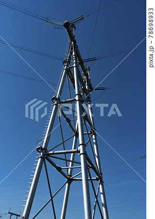 Large massive metal electric pole on four supports. 78698933