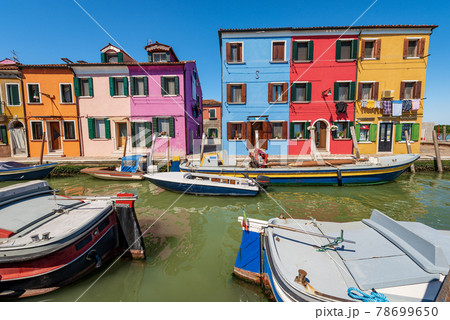 Multi Colored Houses and Canal with Boats in Burano Island - Venice Italy 78699650