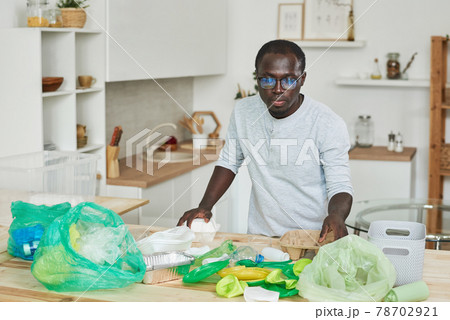 Man sorting the garbage Man sorting the garbage 78702921