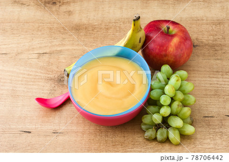 Baby food: colorful bowl of fruit puree 78706442