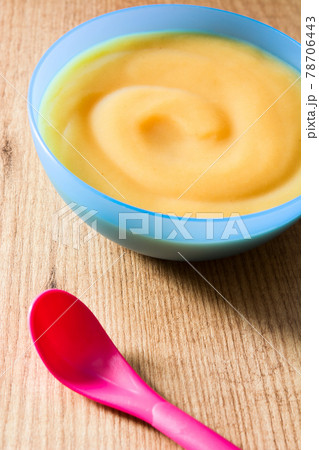 Baby food: colorful bowl of fruit puree 78706443