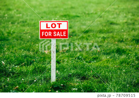 lot for sale plate sign, green grass background lot for sale plate sign, green grass background 78709515