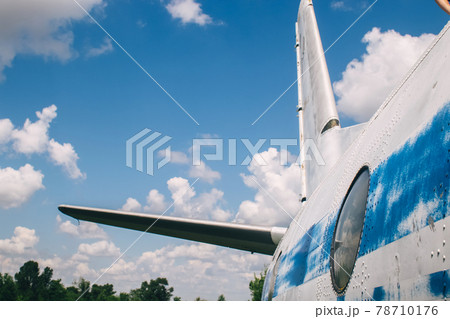 The tail of an aircraft that has collapsed from time to time or from an accident. Metal parts of the frame, parts of the fuselage, skin and pieces of fabric are visible. Rust and scraps of old fabric The tail of an aircraft that has collapsed from time to time or from an accident. Metal parts of the frame, parts of the fuselage, skin and pieces of fabric are visible. Rust and scraps of old fabric 78710176