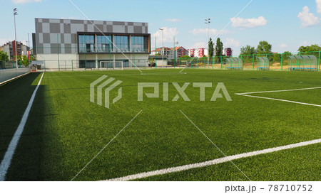 football field with markings. Football stadium. Sports background. Sports center in the city. football field with markings. Football stadium. Sports background. Sports center in the city. 78710752