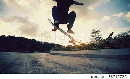 Skateboarder skateboarding outdoors in the morning 78715725