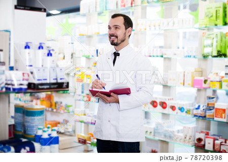 Pharmacist checking drugs in pharmacy Pharmacist checking drugs in pharmacy 78720398