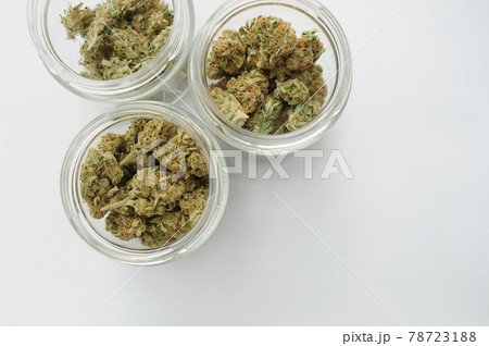 Marijuana buds storage. Medicinal cannabis flowering on white background, isolated, top view. 78723188
