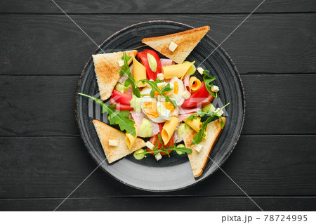 Overhead view of boiled eggs with slices of toast, cheddar, ham and tomato Overhead view of boiled eggs with slices of toast, cheddar, ham and tomato 78724995
