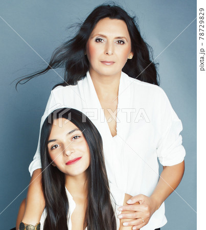 cute pretty teen daughter with mature mother hugging, fashion style brunette, lifestyle people concept cute pretty teen daughter with mature mother hugging, fashion style brunette, lifestyle people concept 78729829