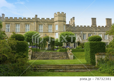 Corby, U.K., 6 May 2021. Dene Park Castle. Old big medieval traditional english castle building with green gardens panorama Corby, U.K., 6 May 2021. Dene Park Castle. Old big medieval traditional english castle building with green gardens panorama 78732381