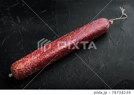 Beef Salami Sausage, on black dark stone background, with copy space for text Beef Salami Sausage, on black dark stone background, with copy space for text 78738239