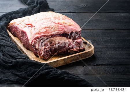 Top sirloin beef steak cut, on black wooden table, on black wooden table 78738424