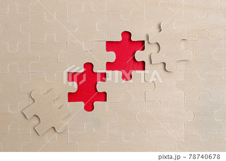 Close-Up White Jigsaw Pattern Puzzle Pieces To Be Connected With Missing Last Piece Positioned On A Flat Lay Background With Different Texture And Paper Supplies Accesories Close-Up White Jigsaw Pattern Puzzle Pieces To Be Connected With Missing Last Piece Positioned On A Flat Lay Background With Different Texture And Paper Supplies Accesories 78740678