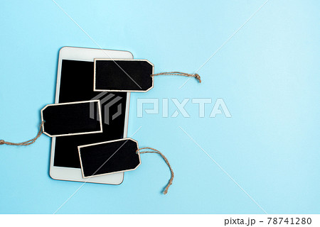 Collection of Real Blank Empty Sticker Card Tag With An Elastic Band On A Different Color Background Containing Modern Gadget Checklist For Labeling Informative Content Purposes 78741280