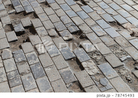 Old damaged cobbled road, concrete street pavement 78745493