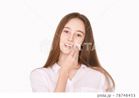 Female teenager person. Cleansing dirty skin. Remove mascara. Cotton pad face 78746453