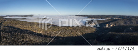 Drone aerial photograph of fog in a large valley in regional Australia Drone aerial photograph of fog in a large valley in regional Australia 78747174