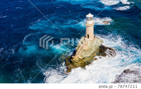 The beautiful Lighthouse Tourlitis of Chora at night. Andros island, Cyclades, Greece 78747211