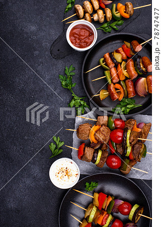 Grilled kebabs with meat, mushrooms and vegetables 78747477