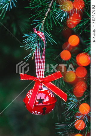 Christmas ornaments hanging on a Christmas tree; holidays background 78747692