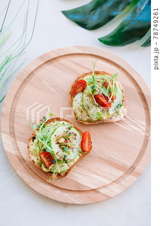 Tasty italian bruschetta on the wooden plate 78749261